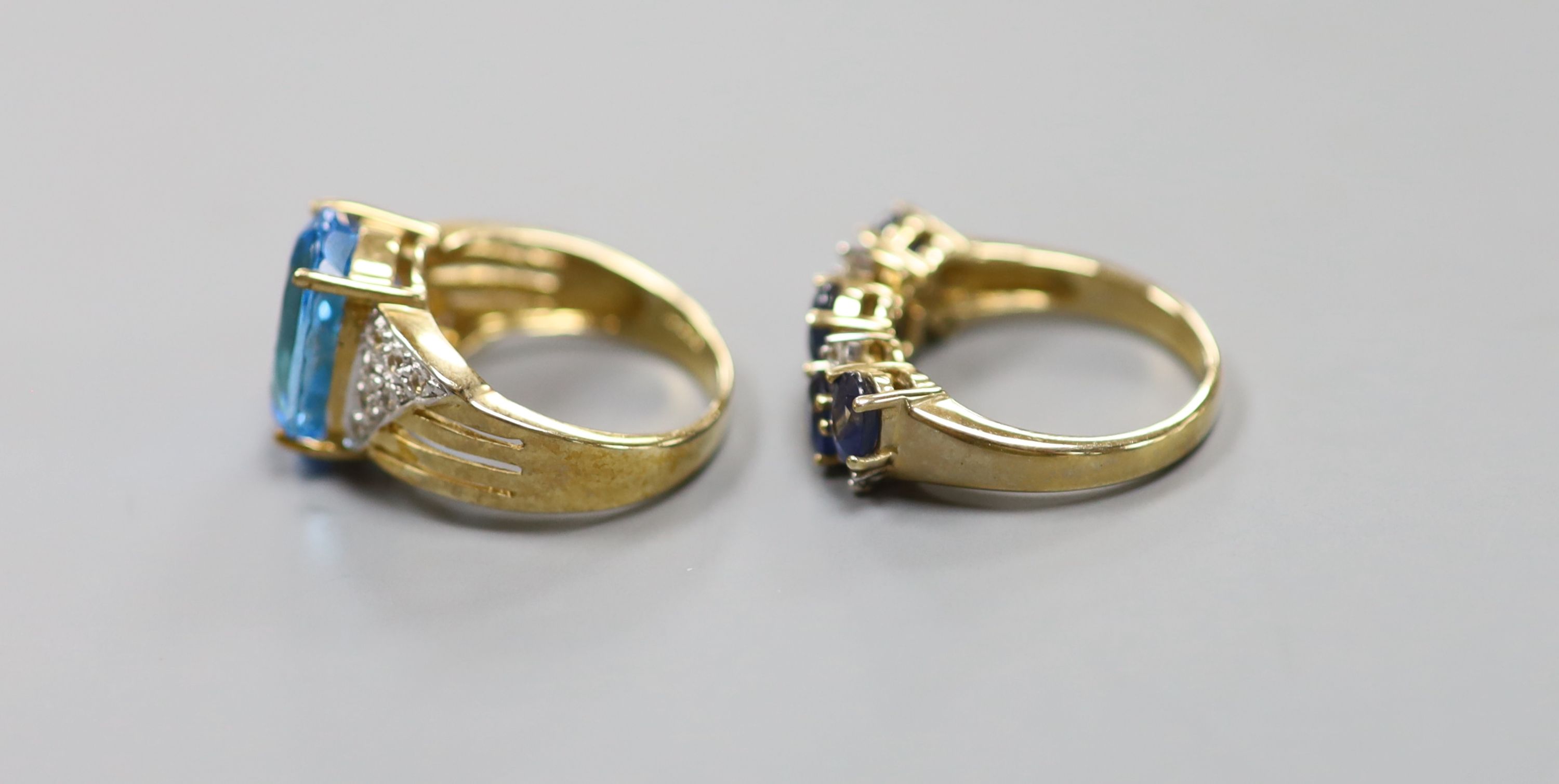 A sapphire and diamond double line ring, 9ct gold shank and another 9ct gold ring set blue and white topaz